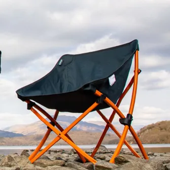A camping chair in organe and blue
